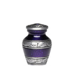 Load image into Gallery viewer, A small decorative urn with a textured deep purple body and silver-toned metal lid and bands featuring engraved floral and scroll patterns, shown on a white background with a 'PACK' label in the corner.