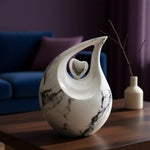 Load image into Gallery viewer, SOULURNS White Marble Teardrop Cremation Urn – 200 lbs Large Adult Memorial Urn with Silver Heart Accent
