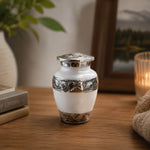 Load image into Gallery viewer, SOULURNS Mini Keepsake Cremation Urn for Human Ashes – Small White Enamel Urn with Embossed Silver Floral Band, Elegant Aluminium Sharing Urn, 3 lbs