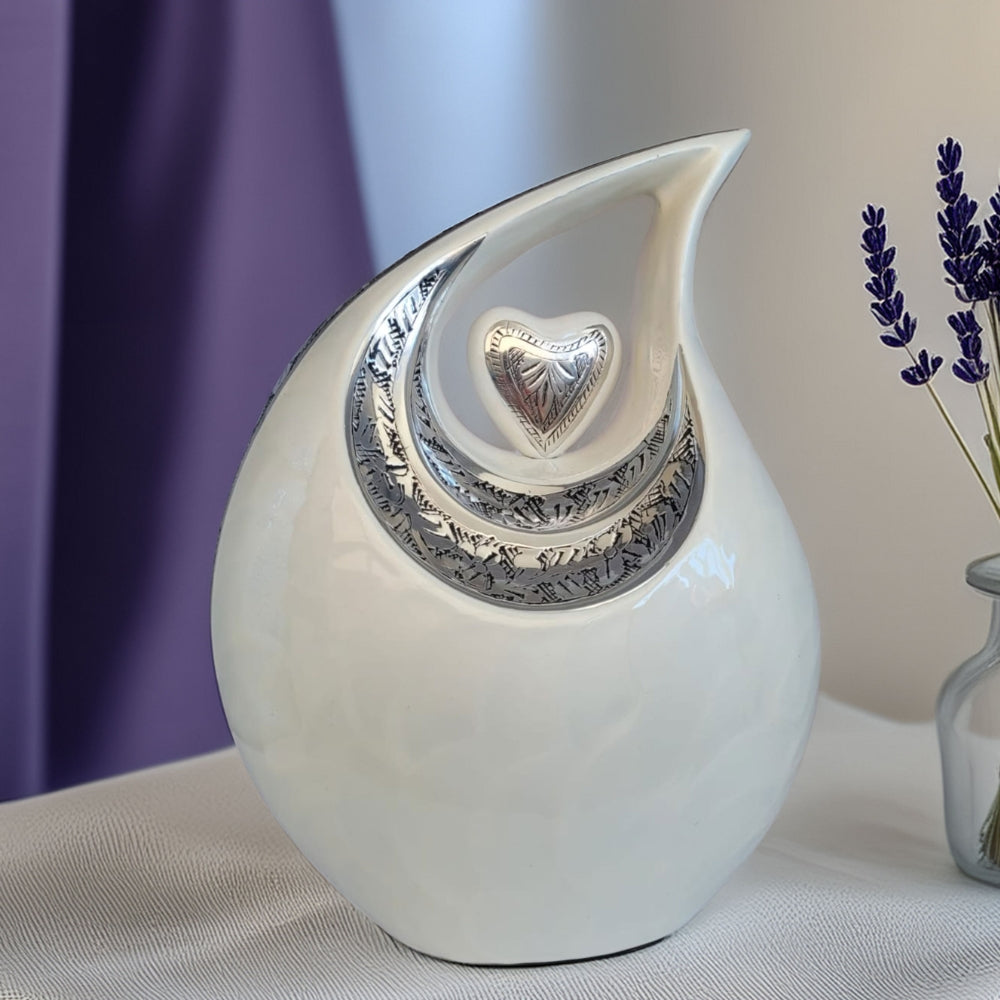SOULURNS Cream Teardrop Cremation Urn – Silver Heart Embossed Memorial Urn for Ashes