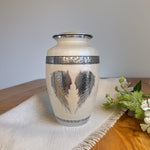 Load image into Gallery viewer, SOULURNS Angel Wings Urn for Human Ashes – White Enamel Adult Cremation Urn, Engraved Wings Design, Large Memorial Urn 198 lbs Capacity